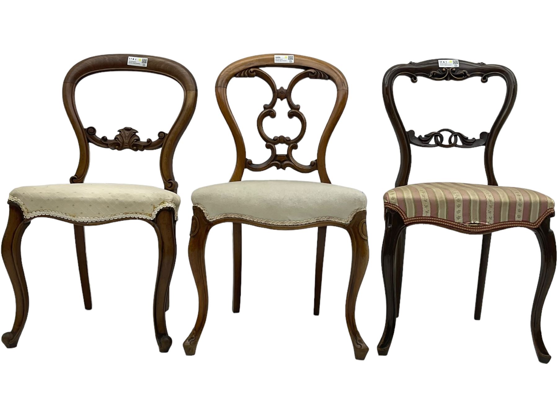 Mixed set of five Victorian chairs - Victorian rosewood dining chair with foliage carved cresting rail; Victorian mahogany balloon back dining chair with foliage carved middle rail; Victorian walnut balloon back dining chair with C-scrolled back; Victorian walnut dining chair with ring and curled leaf carved middle rail; Victorian mahogany balloon back dining chair with C-scroll and foliage carved middle rail (5)