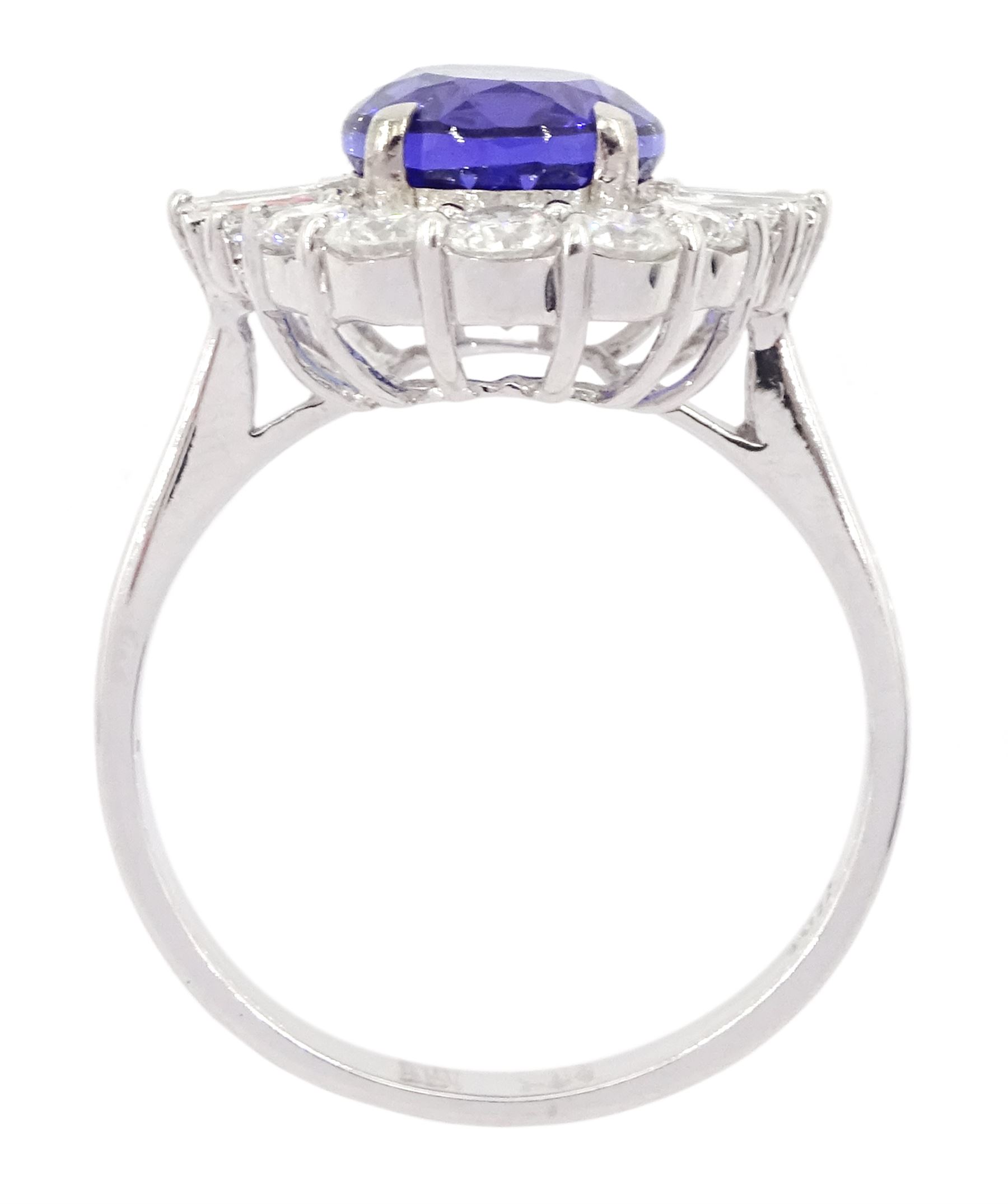 18ct white gold oval cut tanzanite, baguette and round brilliant cut diamond cluster ring, tanzanite 3.00 carat, total diamond weight 0.82 carat, with World Gemological Institute report