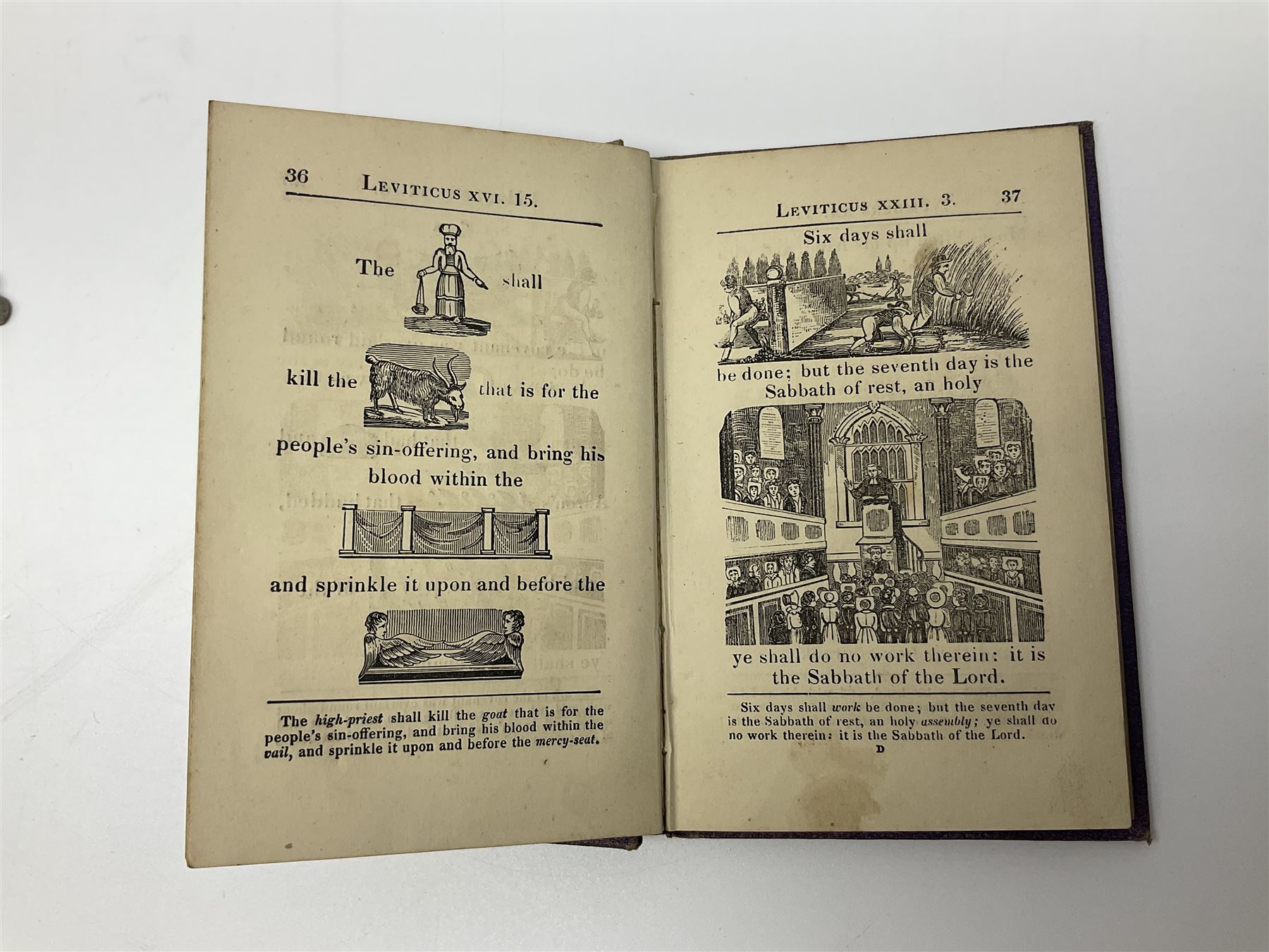 Early 20th century Hieroglyphic Bible or Select Passages from the Old and New Testament Represented by Emblematical Figures For The Amusement and Instruction of Youth, pub. Houlston and Sons, London, together with a wooden crucifix with metal banding and details, including skull and crossbones motif, and one other crucifix