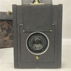 Early 20th century Adams and Co 'Videx' folding plate camera, in original leather carrying case, with various quarter plates