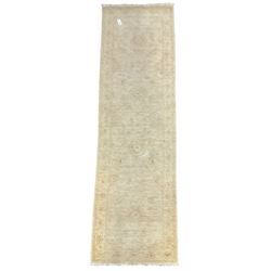 Persian Zeigler runner, ivory ground decorated with faint floral design 