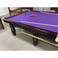 Riley - full-sized 12' x 6' slate bed snooker table, mahogany frame with purple baize, raised on turned and fluted baluster supports, recently refurbished; together with, cues, scoreboard, cover, snooker and pool balls