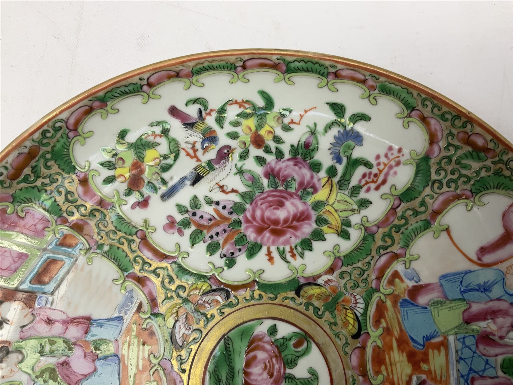 Chinese Famille Rose plate, decorated in polychrome enamels with four figural panels, D24cm.