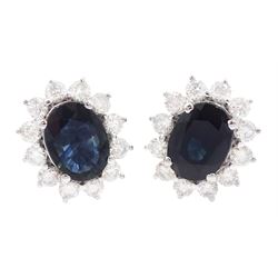 Pair of 18ct gold oval cut sapphire and round brilliant cut diamond cluster stud earrings, stamped 750, total sapphire weight approx 3.05 carat, total diamond weight approx 0.75 carat