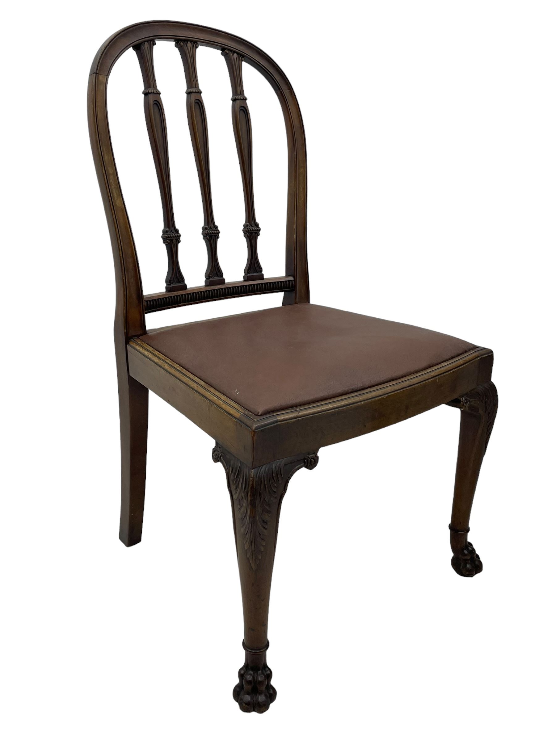 Set of six early 20th century Hepplewhite design mahogany dining chairs, moulded arched frame back, three shaped vertical rails carved with stylised foliate decoration, drop-in seats upholstered in brown fabric within moulded seat rails, on acanthus leaf carved cabriole supports with paw carved terminals 