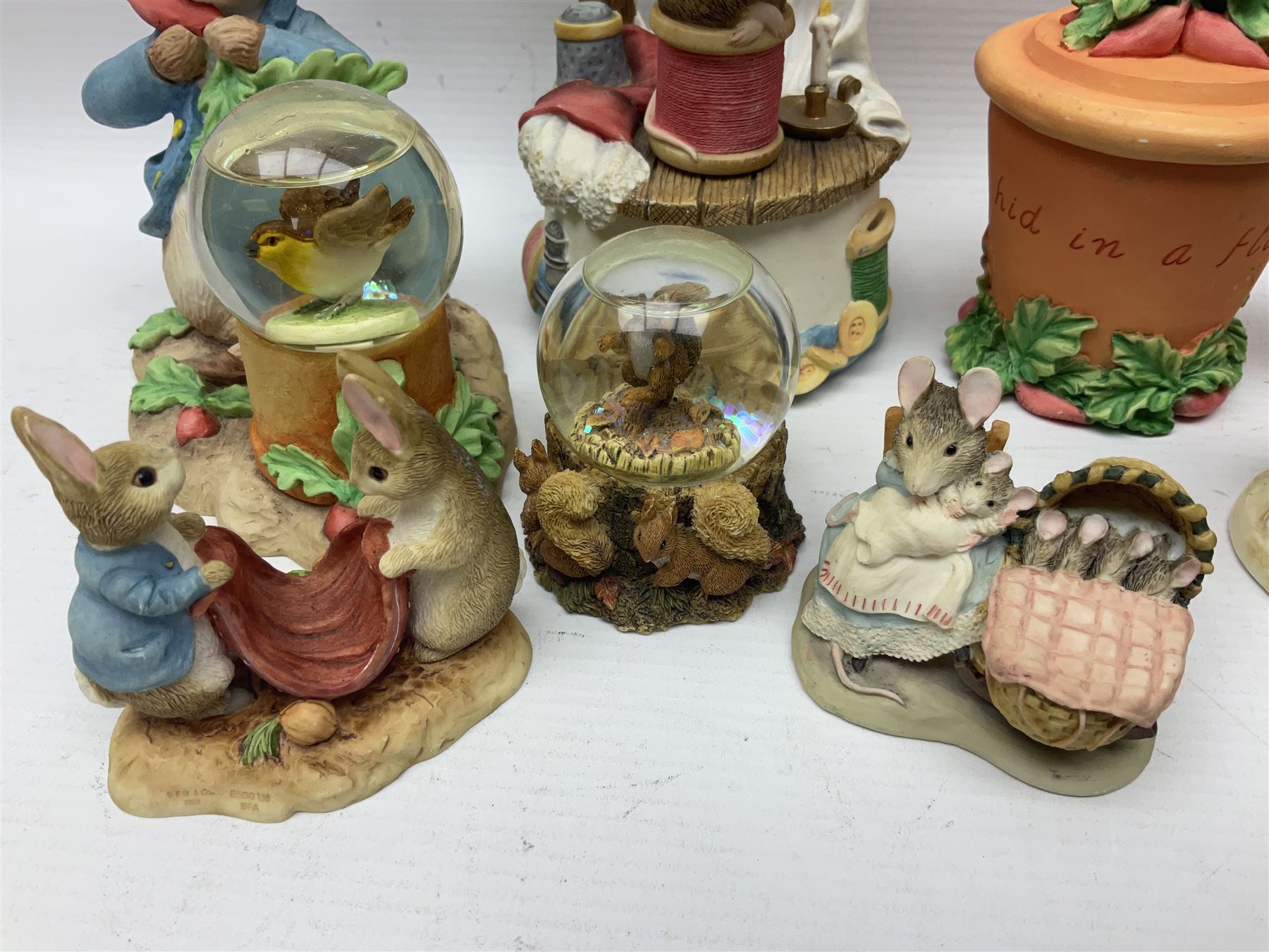 Twelve Border Fine Arts The World of Beatrix Potter and Peter Rabbit Collection figures, including Musical Tailor of Gloucester, Peter Rabbit with Miniature Waterball, Peter Hid in a Flowerpot trinket box, Jemima Puddle Duck with Herbs and Gentleman Mouse, etc