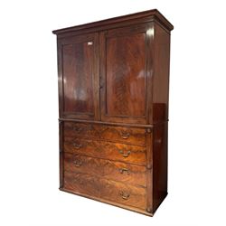 Victorian mahogany linen-press, moulded cornice over two figured panelled doors, the interior fitted with five slides and hanging rail, four long drawers below 