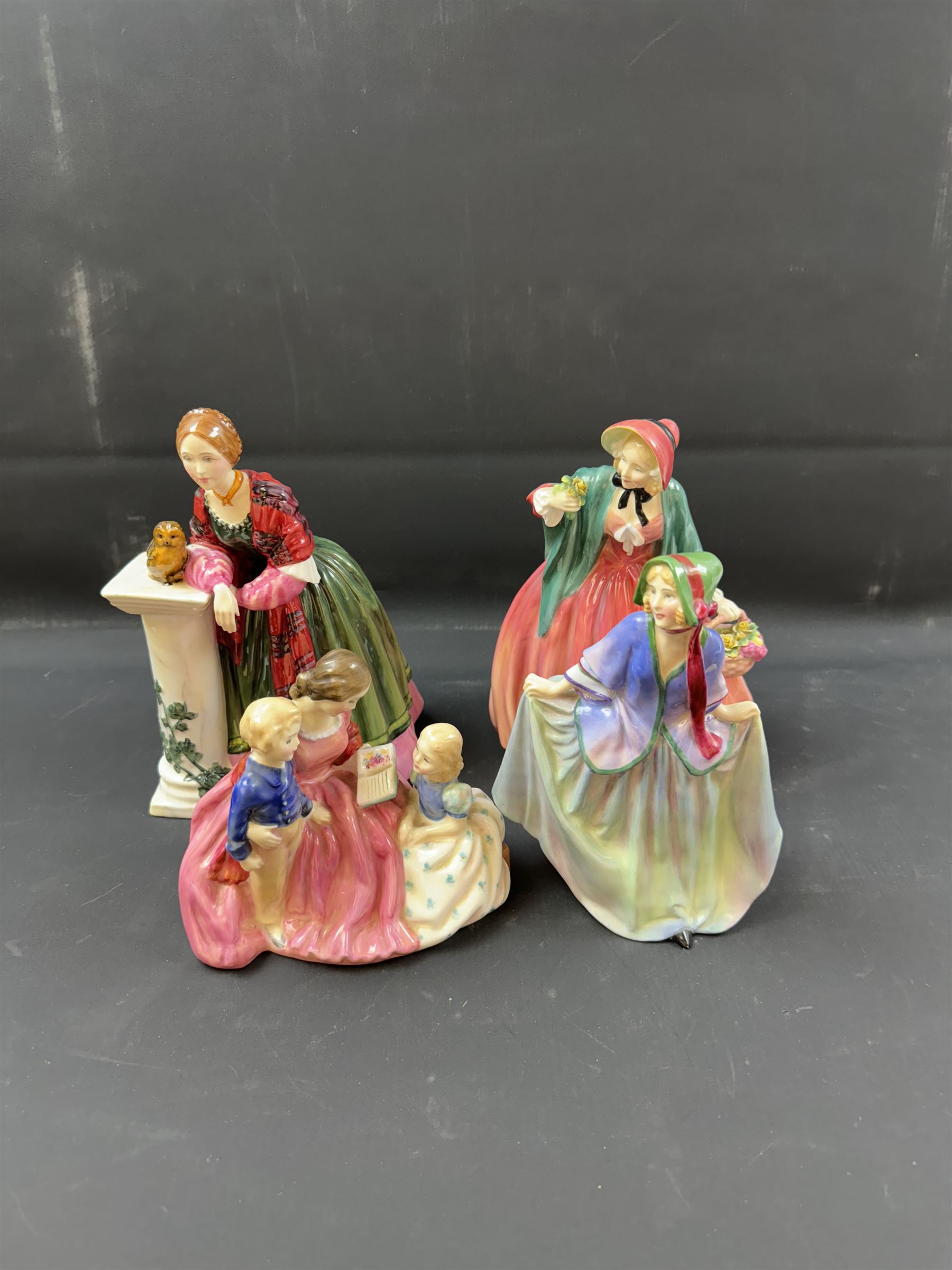 Four Royal Doulton figures, comprising Florence Nightingale HN3144, The Bedtime Story HN2059, Lady Charmain HN1949 and Sweet Anne HN1315 