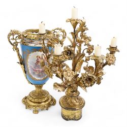 Pair of 19th century Sevres pattern porcelain and ormolu six light candelabra, each with branches cast as lilies, carnations etc, the two handled vase shaped base with oval panels painted with cherubs amongst flowers on a bleu de ciel surround and raised on an ormolu foliate stem and circular base with scrolling bracket feet H76cm (2)  