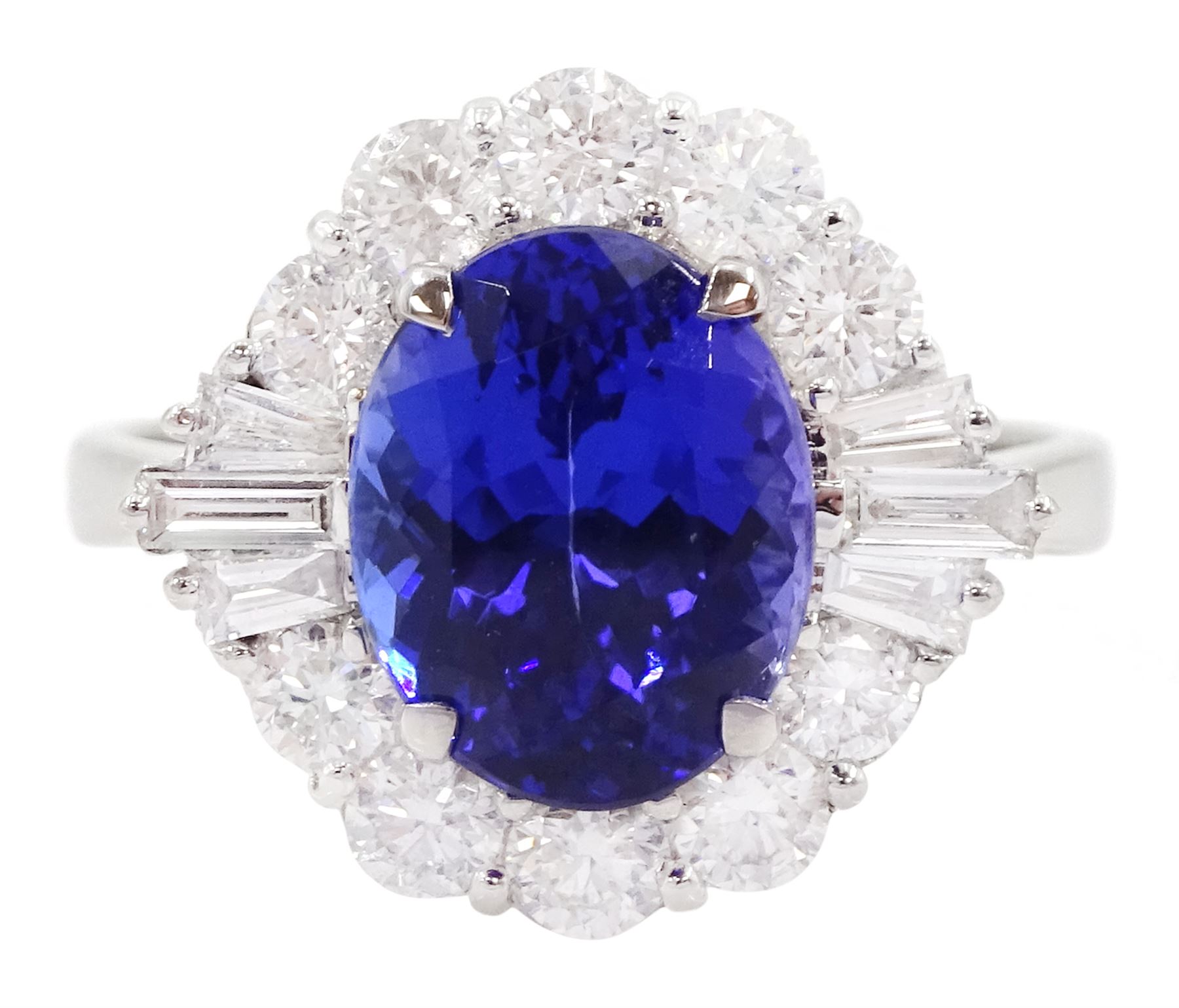 18ct white gold oval cut tanzanite, baguette and round brilliant cut diamond cluster ring, tanzanite 3.00 carat, total diamond weight 0.82 carat, with World Gemological Institute report