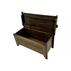 20th century oak coffer or blanket chest, rectangular hinged top over repeating Gothic arch carved front and shaped sides, constructed with pegged joints, on stile supports