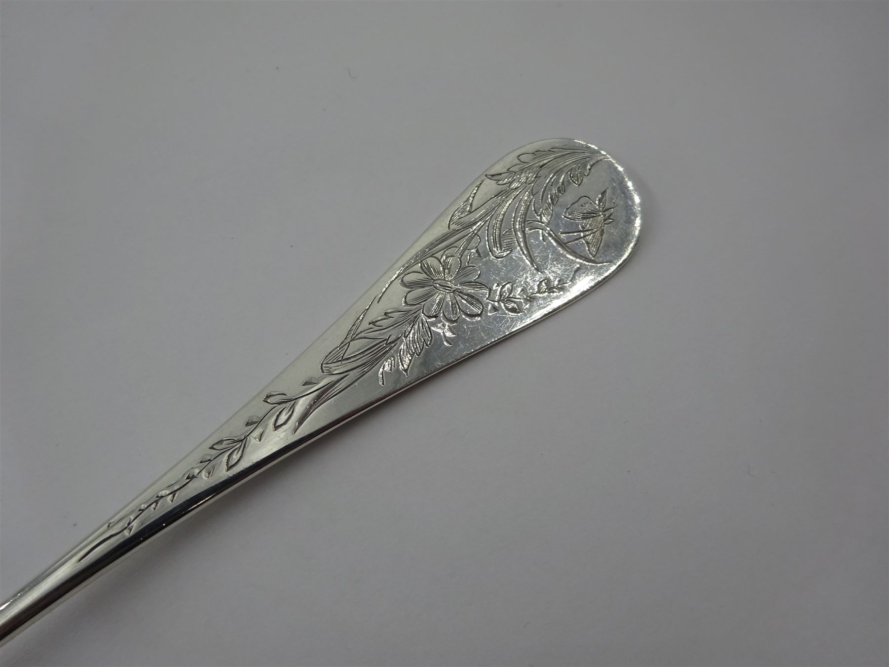 French silver aesthetic movement serving spoon, the scallop edged bowl engraved with a bird amongst flowers and foliage, stamped with Minerva's head standard and weevil export mark, L23cm