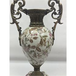 Wong Lee, twin handled ceramic urn with enamelled floral decoration and bronzed metal mounts, upon a square base, marked to base, together with similar twin handled urn with enamelled Cherub decoration, largest H44cm