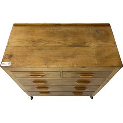 Yorkshire Oak - oak chest, fitted with two short over three long drawers, on octagonal feet with castors 