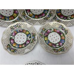 Six Dresden plates, with a pierced and fret border, with gilt rim and painted flower, with printed mark beneath, D18cm