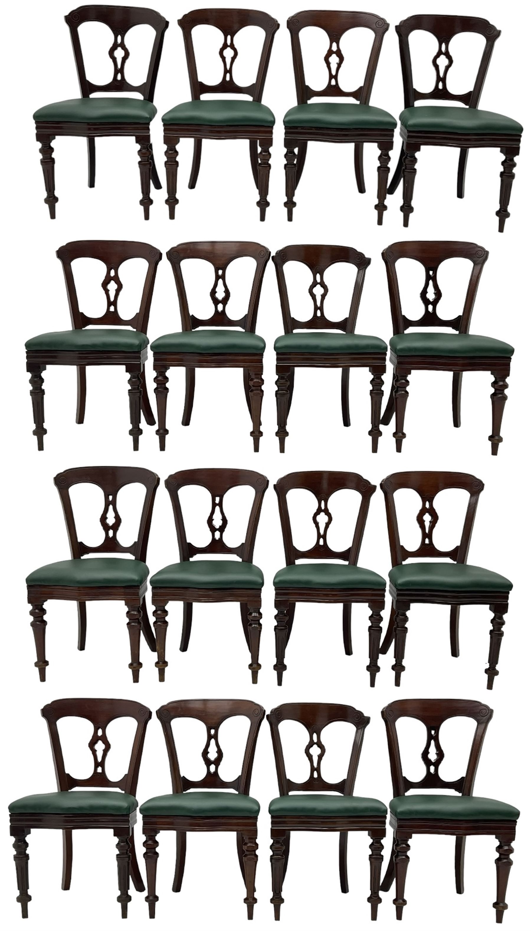 Matched set of twelve Victorian mahogany dining or boardroom chairs, the shaped cresting rail decorated with scrolled decoration, upholstered drop-on seats upholstered in green fabric, on turned supports  