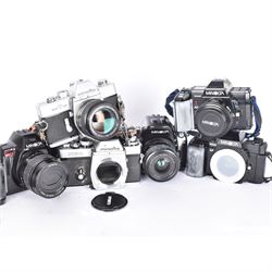 Six Minolta SLR camera bodies, comprising 7000 AF serial no. 12115735, with an AF 50mm 1:1.7 (22) lens serial no. 1148222, 9000 AF serial no. 13102736, 7700i serial no. 19314599, with an AF Zoom 35-80mm 1:4(22)-5.6 lens serial no. 19340884, 807si serial no. 57701857, with a AF Power Zoom 35-80mm 1:4(22)-5.6 lens serial no. 17108604, SRT 101 serial no. 3647794, with a MC Rokkor PG 1:14 f=50mm lens serial no.3192901, and an XE-1 serial no. 1087152