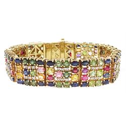 9ct gold sapphire, ruby and diamond bracelet, vari-cut blue fancy coloured sapphires, oval...