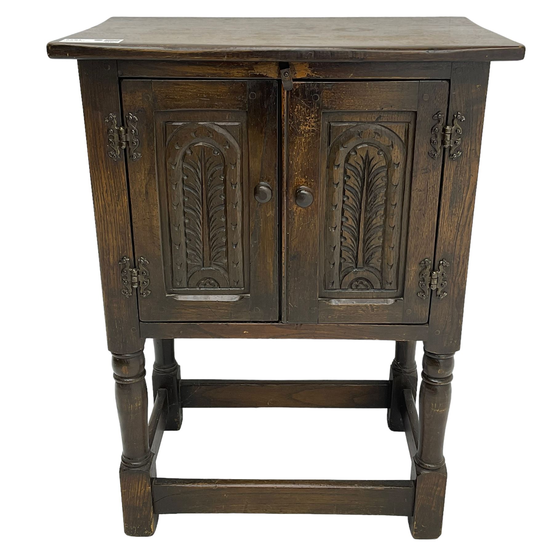 Small oak hutch cupboard, fitted with two carved doors