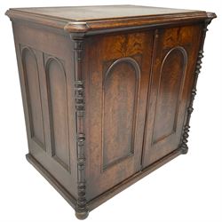 Victorian lacquered mahogany cupboard, fitted with two arch panelled doors enclosing two shelves, flanked by split turned uprights