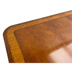 RBC Furniture (Made in England) - Georgian design mahogany dining table, rectangular top with rounded corners, satinwood and burr walnut bandings, two D-ends with two additional leaves and support rails, on barrel turned pedestals with four out-splayed reeded supports, brass cups and castors 