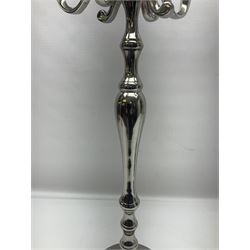 Pair of four branch candelabras, urn-shaped nozzles raised upon scroll branches supported from tapering central stem, with circular base, H70cm