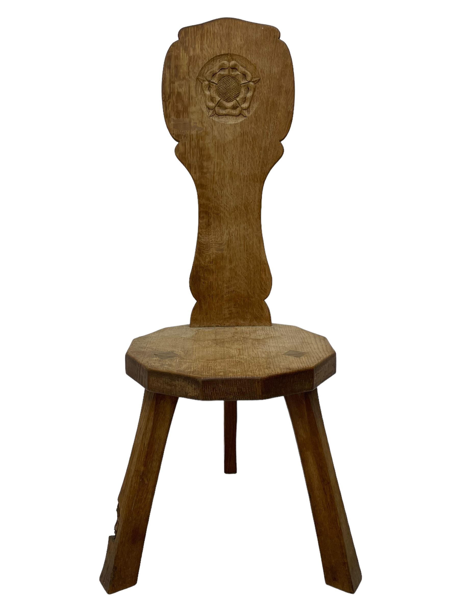 Gnomeman - two oak spinning or hall chairs, shaped splat backs, one carved with Yorkshire Rose, the other with mythical dragon, decagon seats on chamfered square tapering supports, each carved with gnome signature, by Thomas Whittaker, Littlebeck