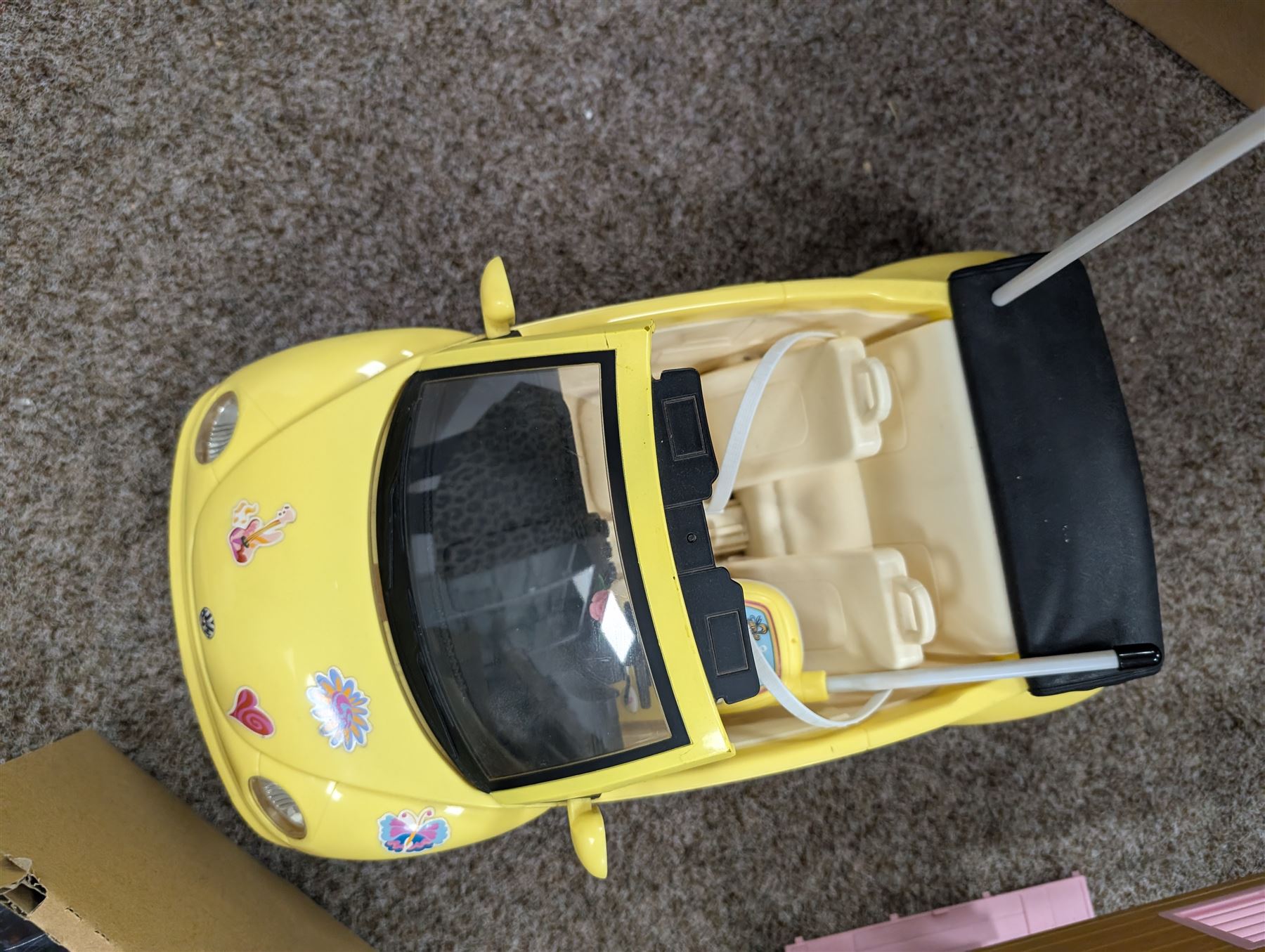 Collection of Barbie dolls, clothes, horse, stable and accessories, including, together with a Mattel Barbie yellow Volkswagen Beetle, with mobile phone remote control