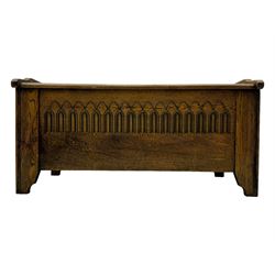 20th century oak coffer or blanket chest, rectangular hinged top over repeating Gothic arch carved front and shaped sides, constructed with pegged joints, on stile supports