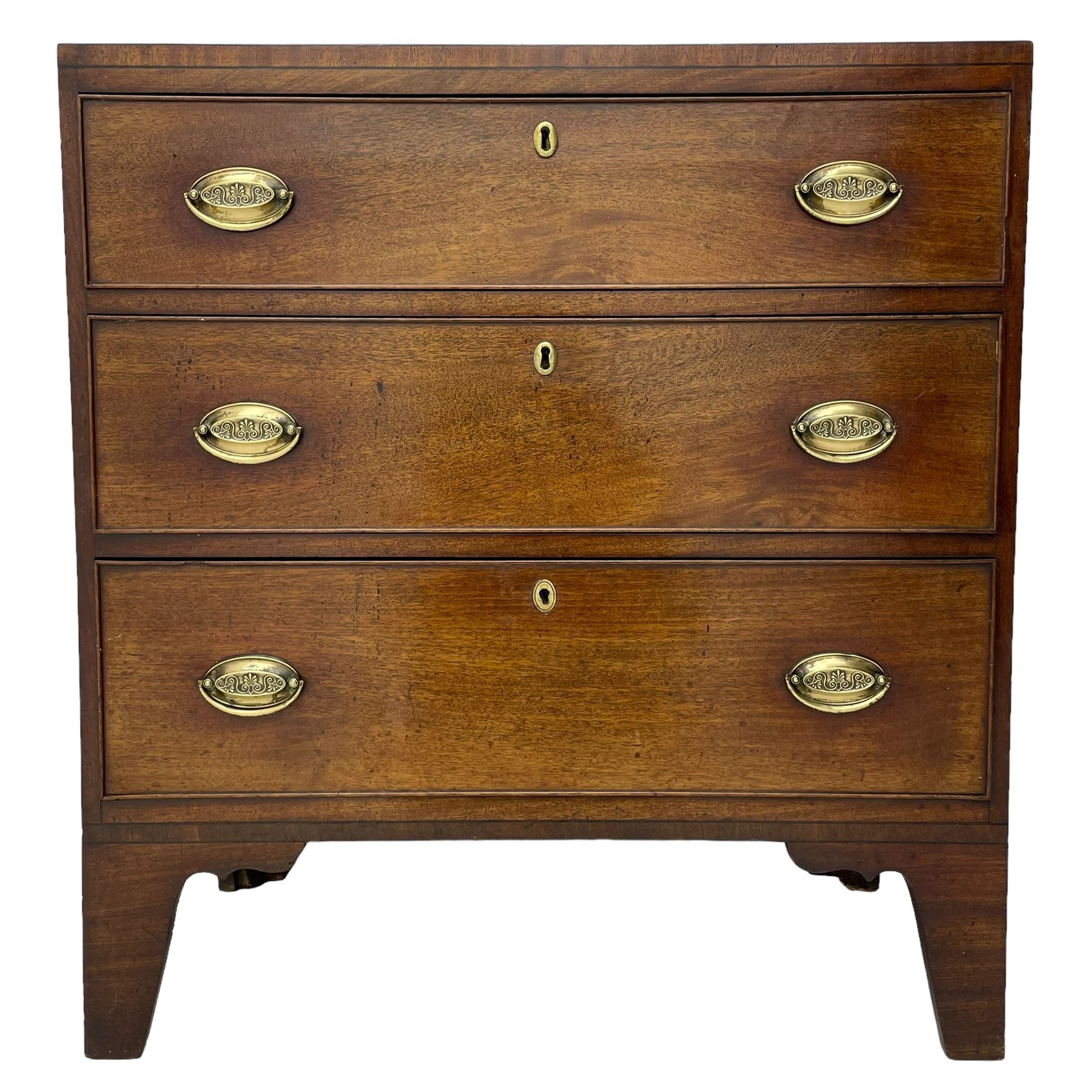 George III mahogany chest, rectangular ebony strung top, fitted with three graduating cock-beaded drawers with oval pressed brass handle plates and demi-lune handles, on tall bracket feet 