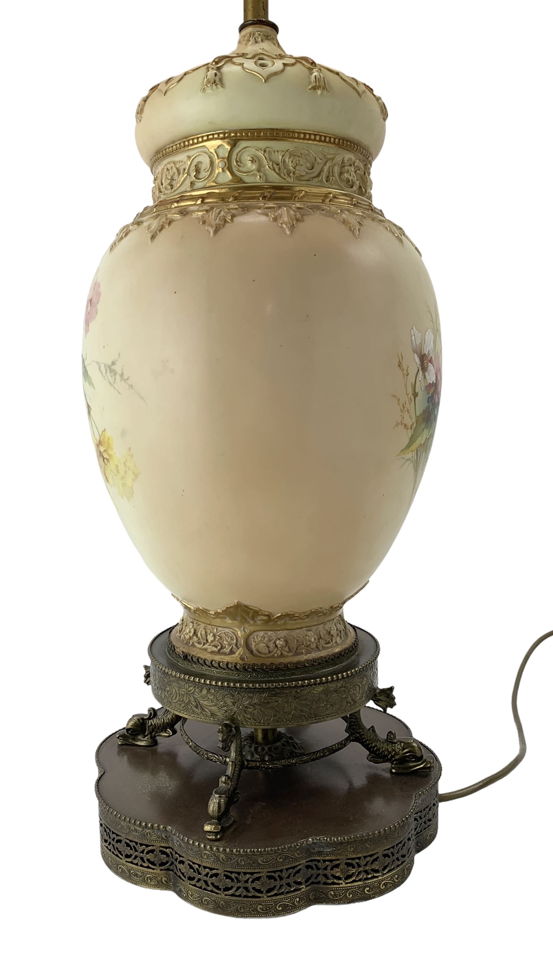 Early 20th century Royal Worcester pot pourri vase and cover, converted to a table lamp, the body painted with sprays of flowers, above a pierced spire cover and relief moulded borders, mounted upon a circular brass plinth, supported by four dolphin feet and a lobed pierced and beaded platform base, vase shape no. 2048, H39cm, overall including shade 83cm 