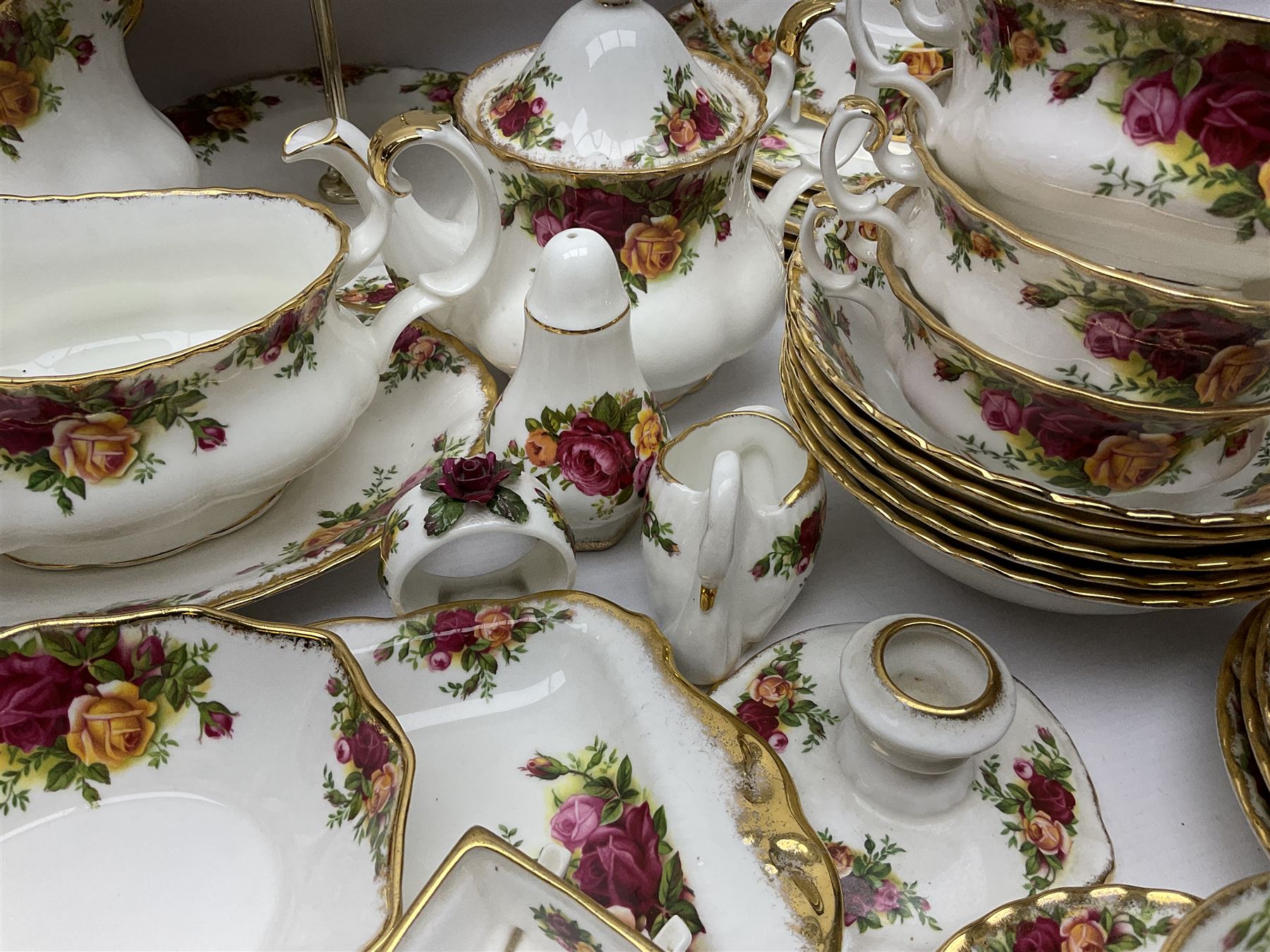 Royal Albert Old Country Roses pattern coffee service for six, comprising coffee pot, milk jug, cups and saucers, cake plate, together with miniature teapot, six teacups and saucers, six dinner plates, six side plates etc 