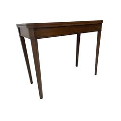 Early 20th century mahogany tea table, fold-over swivel top with rounded corners, raised on square tapering supports