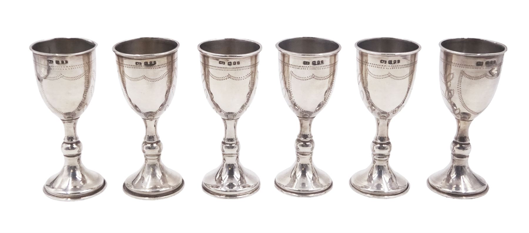 Set of six 1920s silver Kiddush cups, of goblet form with knopped stem, and engraved foliate detail, hallmarked London 1929, maker's mark M.S, H9cm