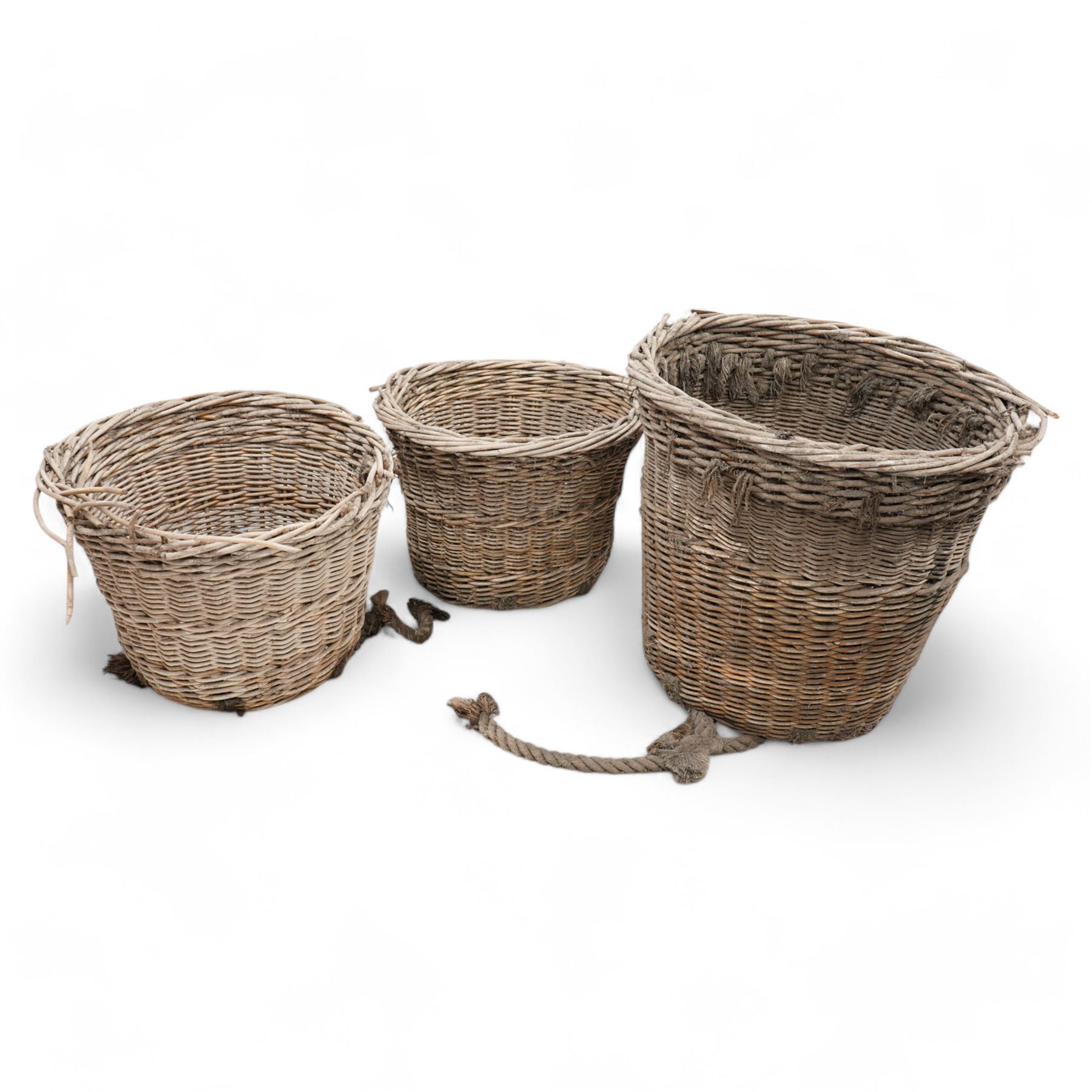 Six large wicker cargo baskets, circular tapering form, the largest height - 81cm