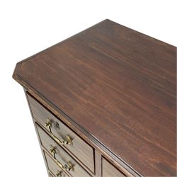 Small George III mahogany chest, rectangular canted form, moulded top over two short and three long cock-beaded drawers, fitted with brass swan neck handles and oval plates, enclosed by fluted upright corners, on bracket feet 