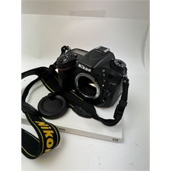 Nikon SLR D7100 camera body, serial no. 2126271, with instruction manual