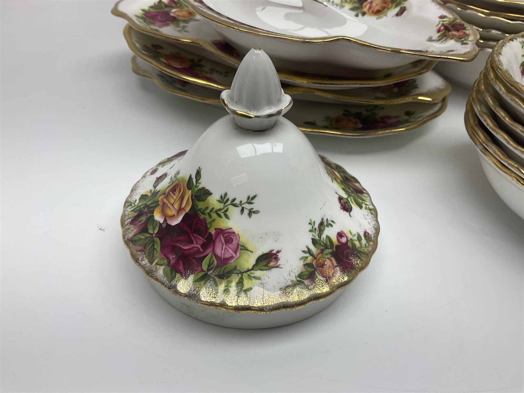 Royal Albert Old Country Roses pattern part tea and dinner service, to include two tureens, eight dinner plates, six side plates, twelve bowls, two mugs, seven teacups and saucers, milk jug,  twelve cake plates, six soup bowls and saucers, candlesticks, etc (95)