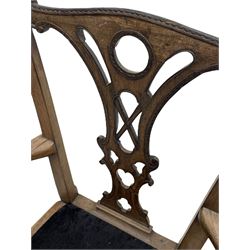 Unusual 18th century mahogany elbow chair, the shaped cresting rail with projecting shell carved ears, pierced and scroll carved splat over drop-in upholstered seat, shaped arms with ball and claw carved terminals, the seat rails carved with shell cartouches, on foliate carved cabriole supports with ball and claw feet 