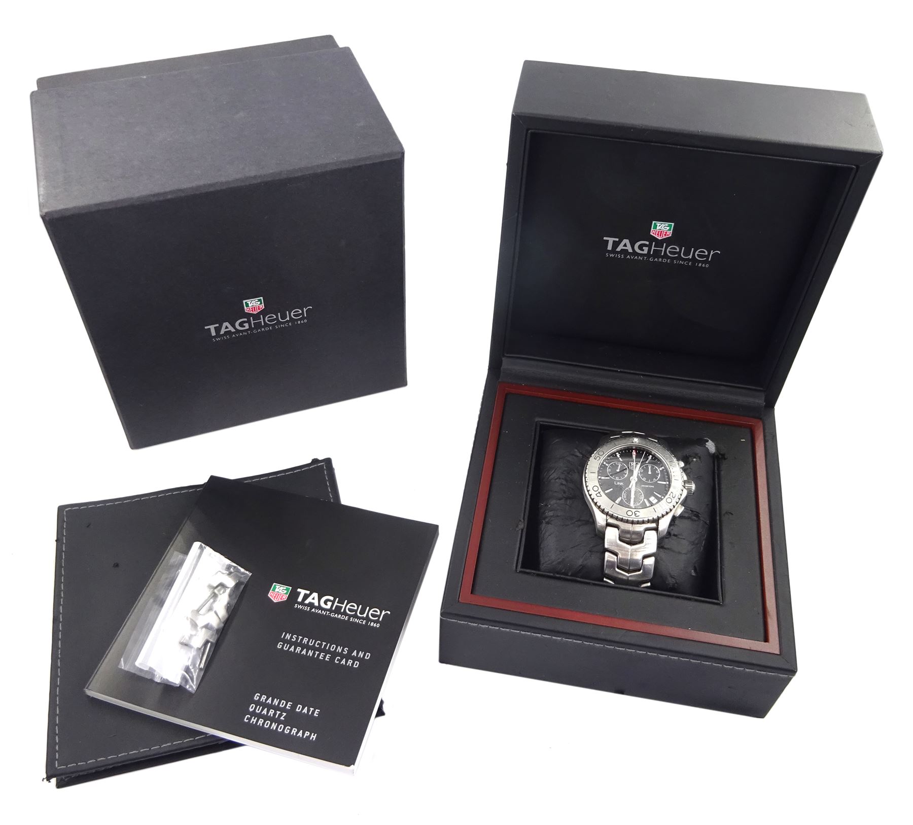 Tag Heuer Link 200 gentleman's stainless steel chronograph quartz wristwatch, Ref. CJ1110, black dial with date aperture between 4 and 5 o'clock, on integral stainless steel bracelet, with fold-over clasp, boxed