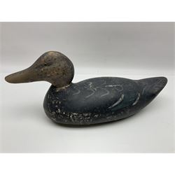 Early 20th century American carved wooden decoy duck, with weight beneath marked CJ Raymond Lead Co Chicago, Ill, H18cm, L38cm 