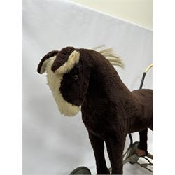 1920s/30s Panurge Pets push-a-long horse, with brown mohair body and white face, horse hair mane and tail and leather hooves, mounted upon a metal with rubber and metal wheels, including handle H71cm