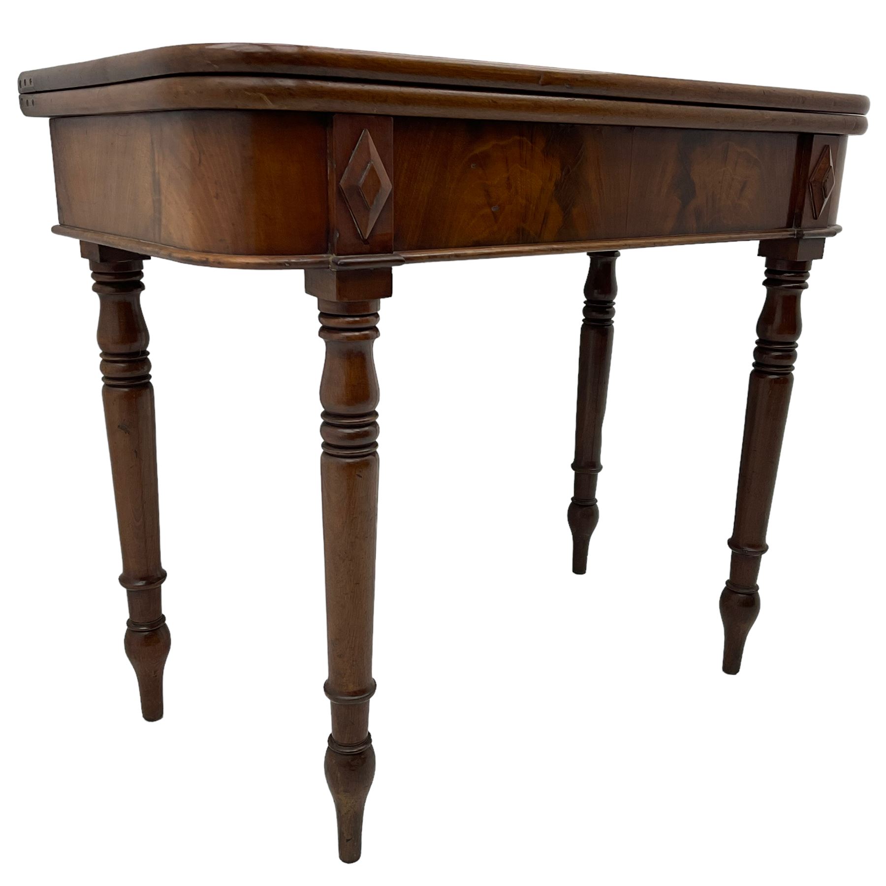 19th century mahogany tea table, fold-over swivel action rectangular top with rounded corners, figured frieze with stepped lozenge mounts, on turned supports