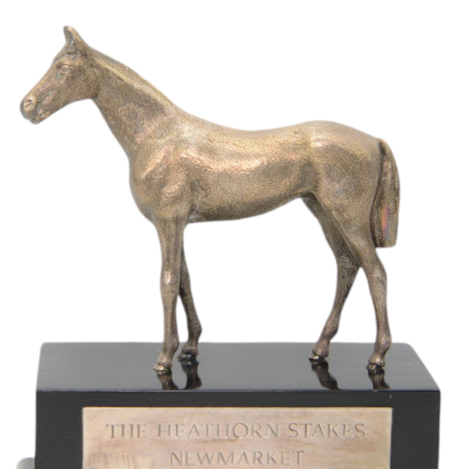 'The Heathorn Stakes, Newmarket 1981' - Silver model of a standing horse on ebonised plinth with silver plaque H20cm x W18cm London 1978 Maker Wakely & Wheeler