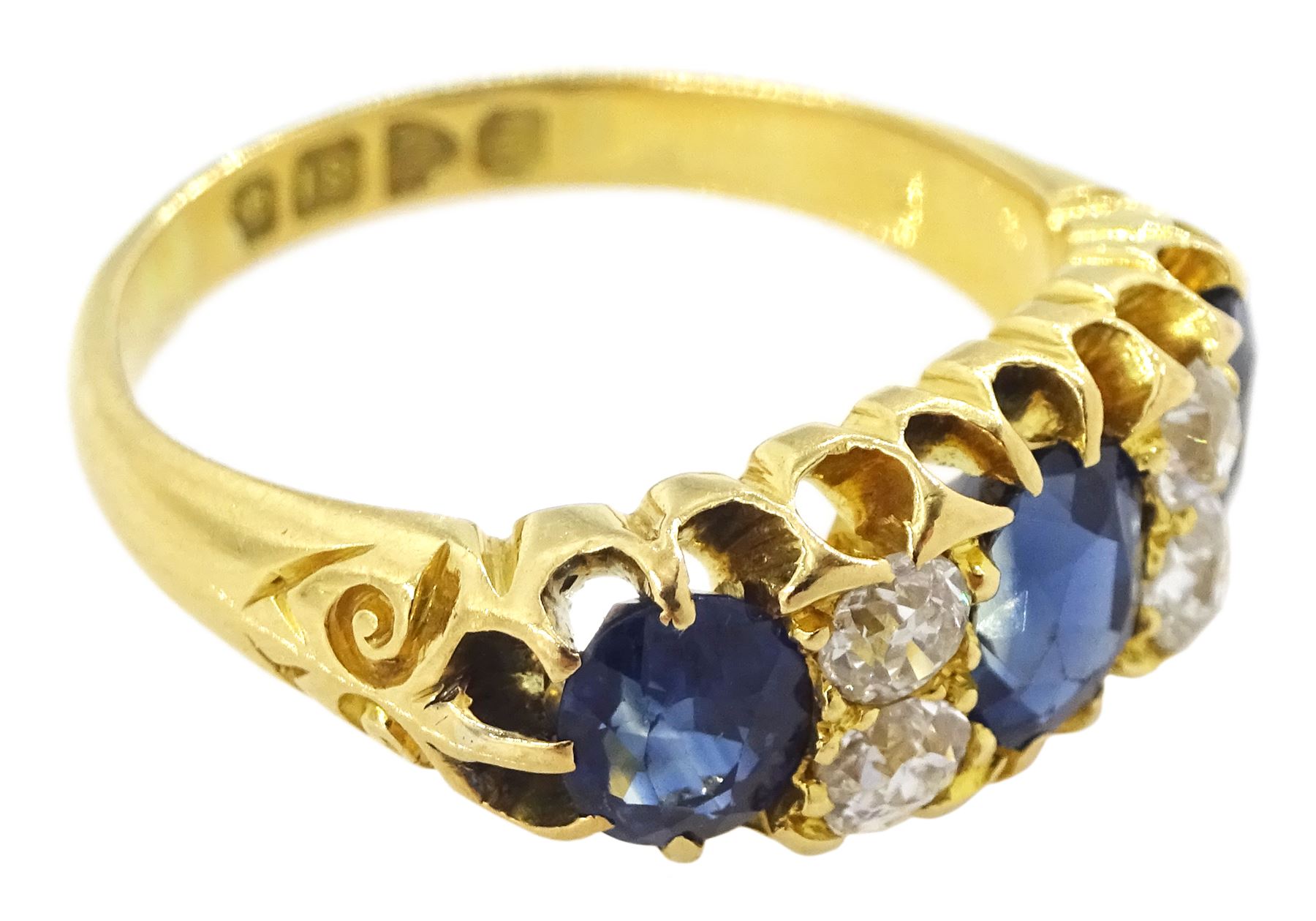 Victorian 18ct gold three stone oval cut sapphire and four stone old cut diamond ring, Chester 1898, total sapphire weight approx 1.70 carat, total diamond weight approx 0.40 carat