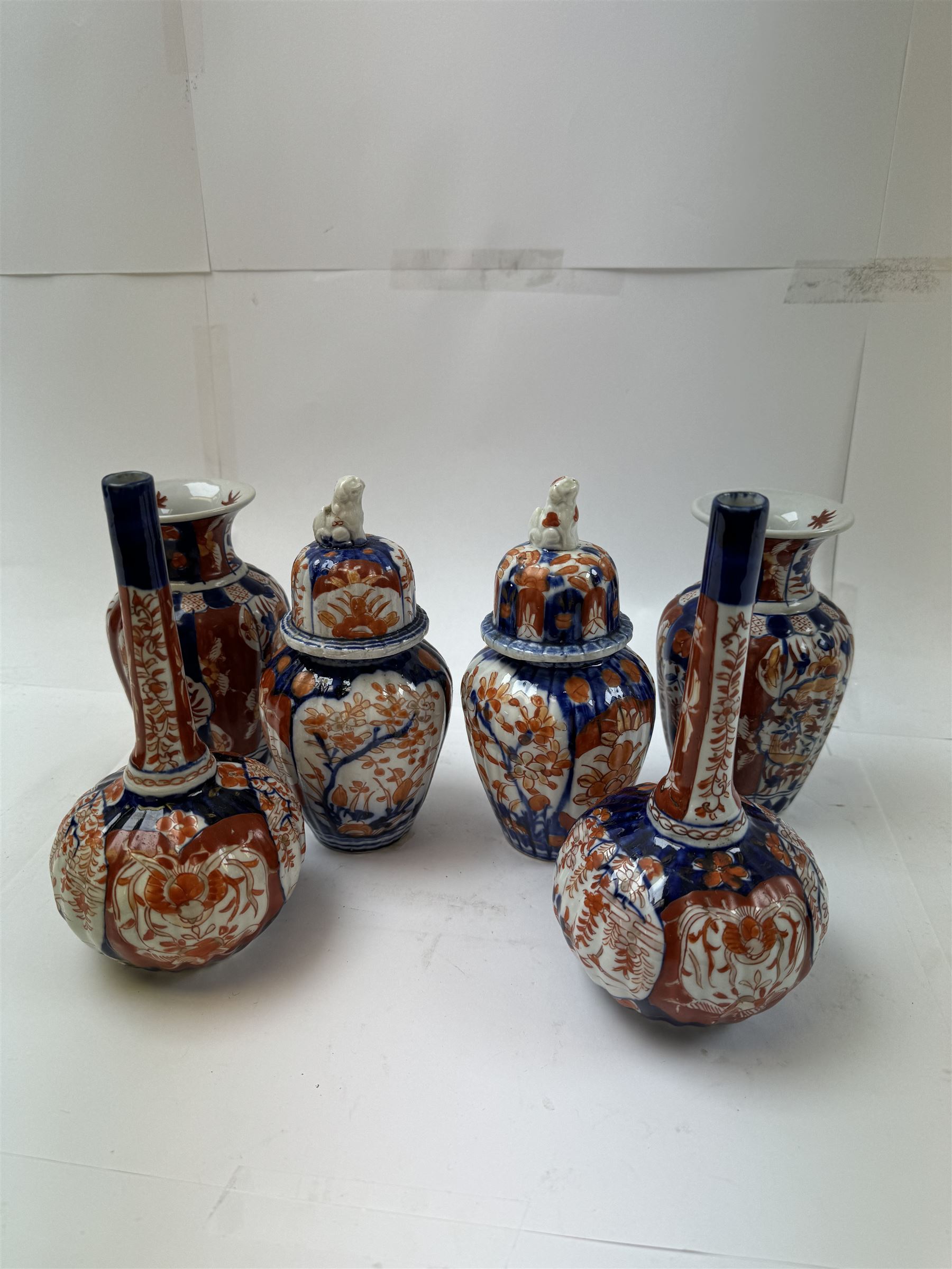 Three pairs of Imari vases, including a pair of baluster form with covers with foo dog finials, tallest H21cm 