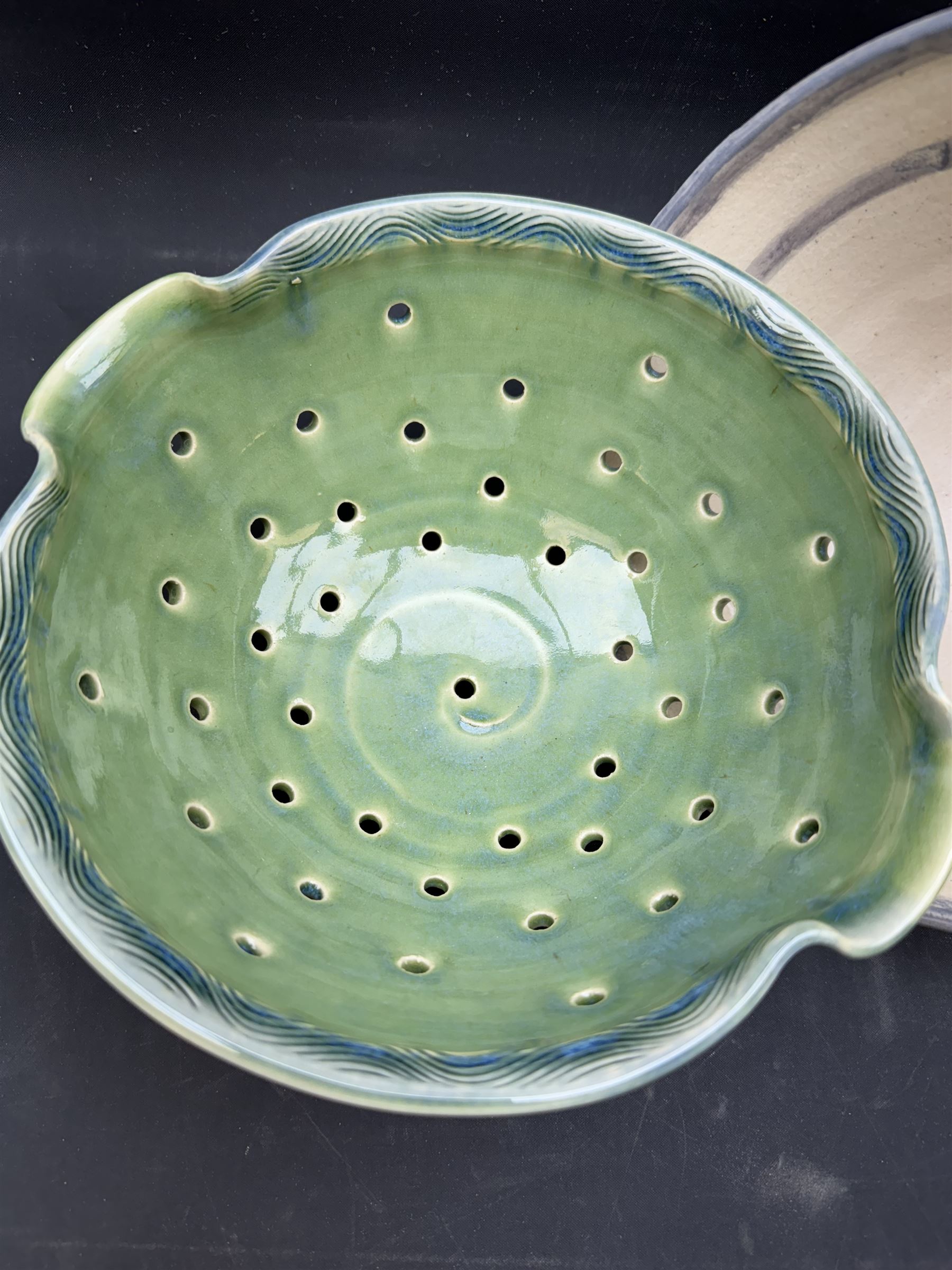 Studio pottery bowl of conical form, with blue band to the rim, together with Arwyn Jones dish, D20cm