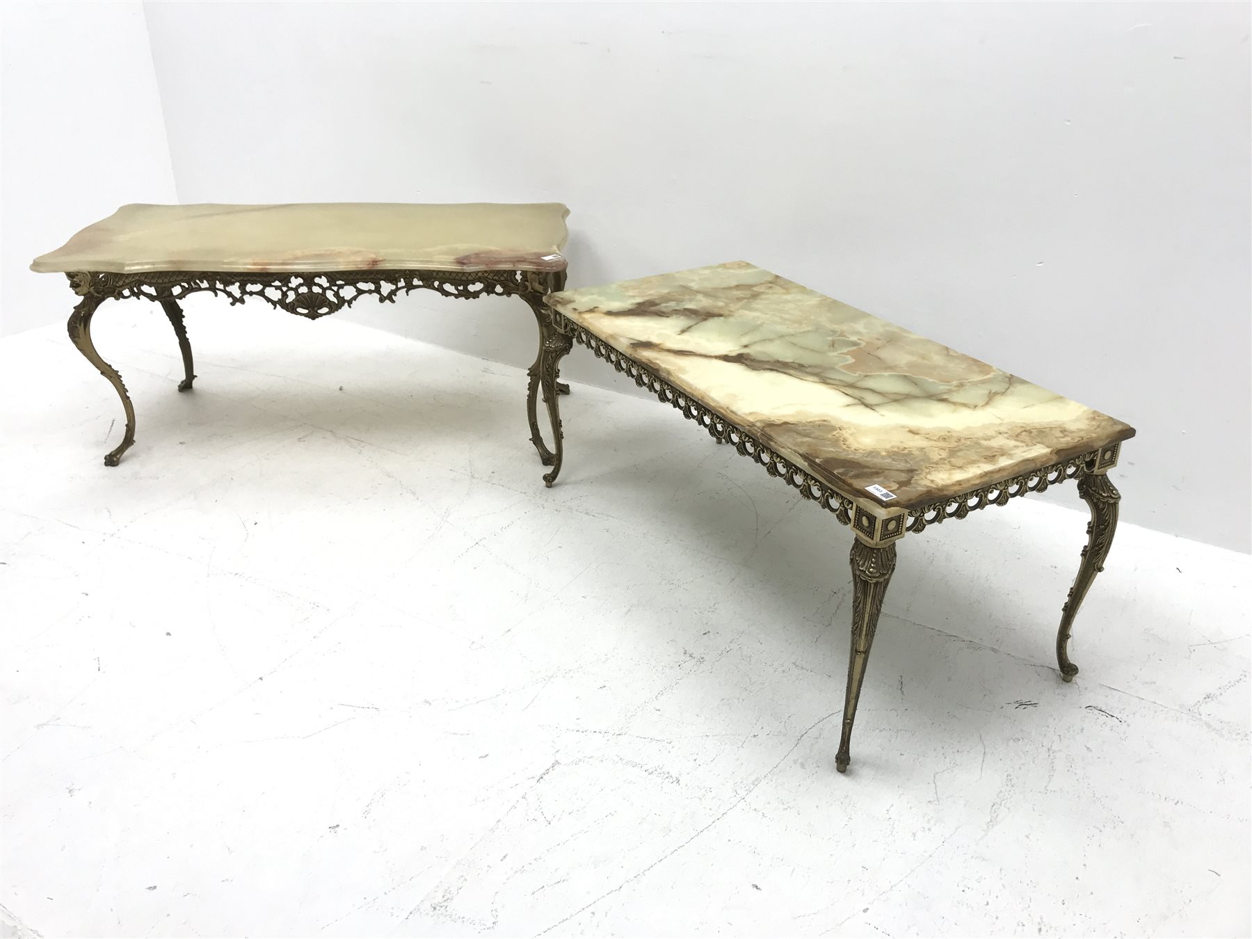 Two vintage onyx coffee tables on ornate gilt metal bases, shaped top table - 111cm x 52cm, H50cm, rectangular top table - 101cm x 50cm, H45cm