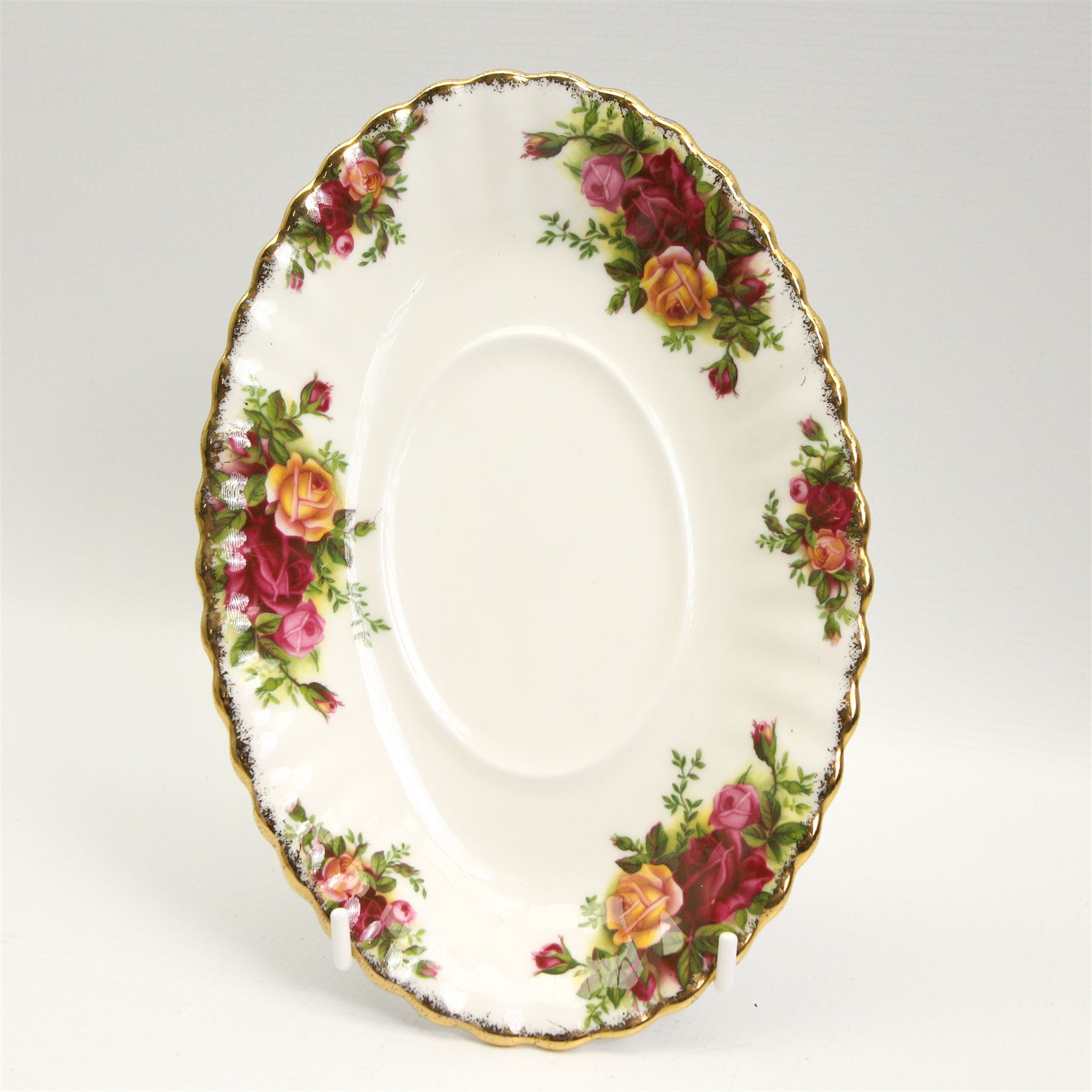 Royal Albert Old Country Roses dinner and tea ware comprising seven dinner plates, eight soup bowls, eight dessert bowls, teacups, saucers and tea plates, two sauce boats and stands, salt & pepper pots, milk jug, sugar bowl, rectangular dish, sandwich plate and oval platter 