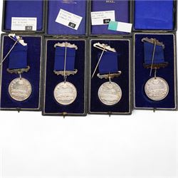 Eight Hull Education Committee 'Perfect Attendance At School' hallmarked silver medallions, each housed in a fitted case